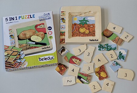 Das Kartoffelpuzzle besteht aus Holz. Eine genauere Beschreibung folgt im Text unterhalb des Bildes.
