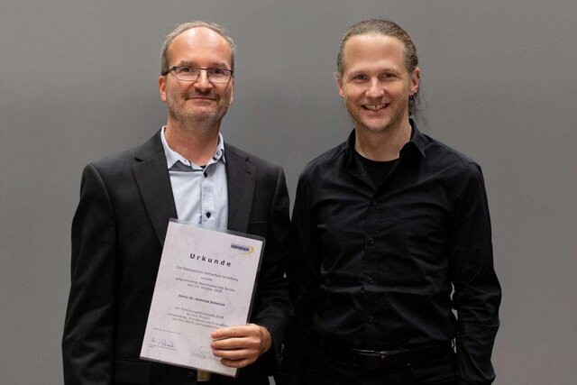 Dr. Andreas Schnirch mit Professor Dr. Christian Spannagel